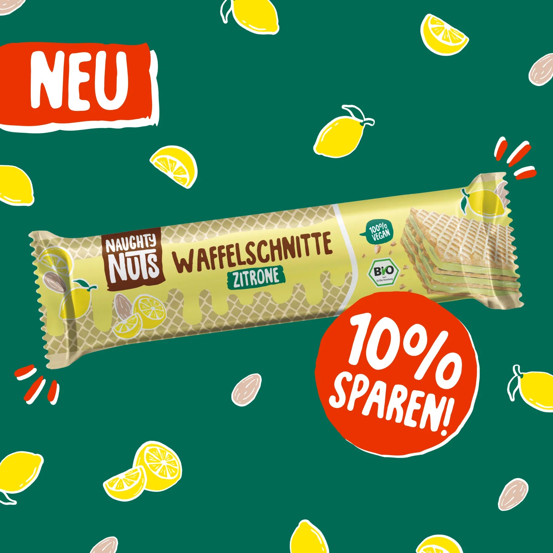 Naughty Nuts Waffelschnitte Zitrone auf grünem Hintergrund mit Zitronen und Mandeln